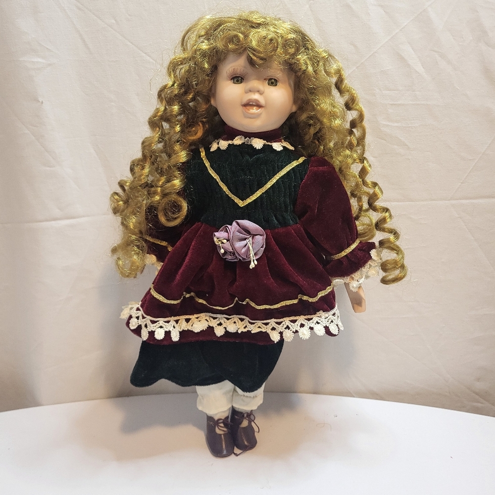 Vintage porcelain doll with stand